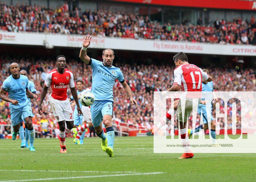 Arsenal s Alexis Sanchez scoring his sides second goal - Barclays Premier League - FC Arsenal London v Manchester City - Emirates Stadium - England - 13th September 2014 -.