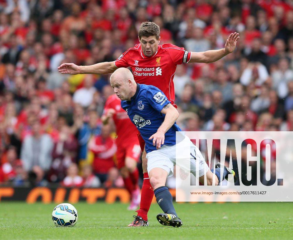 Steven Naismith of Everton cuts across Steven Gerrard of Liverpool - Barclays Premier League - Liverpool vs Everton - Anfield Stadium - Liverpool - England - 27th September 2014 - Picture Simon Bellis Sportimage .