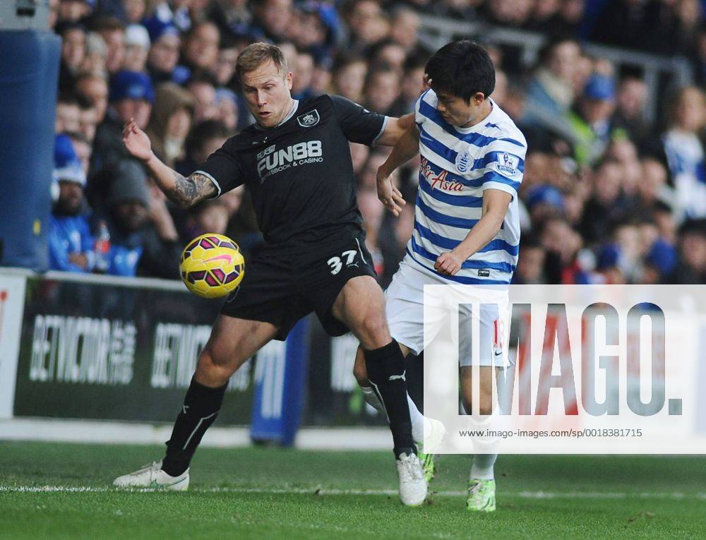Football - 2014 2015 Premier League - Queens Park Rangers vs. Burnley QPR Yun Suk Young and Scott Arfield at Loftus Road. COLORSPORT ANDREW COWIE