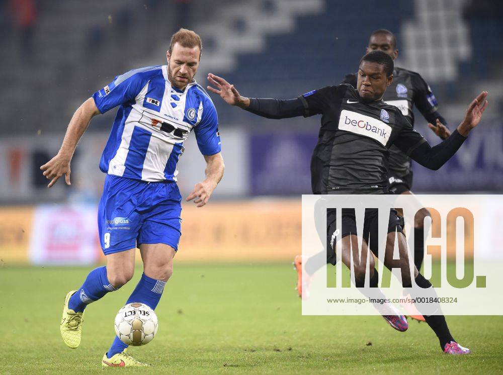 - GENT, BELGIUM: Gent s Laurent Depoitre and Genk s Christian Kabasele fight for the ball during the Jupiler Pro League match between KAA Gent and KRC Genk, in Gent, Sunday 07 December 2014, on day 18 of the Belgian soccer championship. JOHNxTHYS x04516925x