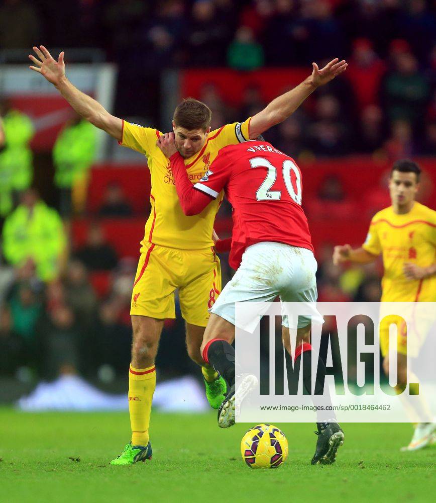 Robin van Persie of Manchester United ManU battles Steven Gerrard of Liverpool - Manchester United vs. Liverpool - Barclay s Premier League - Old Trafford - Manchester - 14 12 2014 Pic Philip Oldham Sportimage .