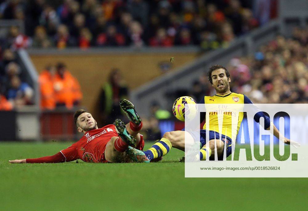 Liverpool s Adam Lallana tussles with Arsenal s Mathieu Flamini Barclays Premier League - Liverpool vs Arsenal - Anfield - England - 21st December 2014 - Picture David Klein Sportimage .