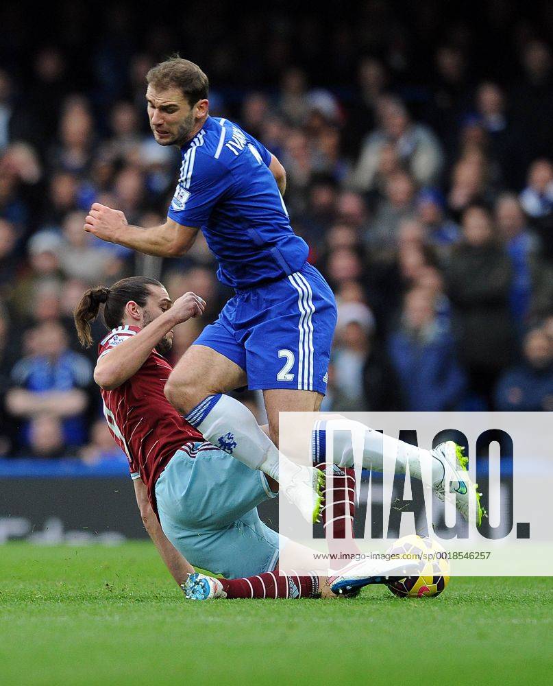 Andy Carroll of West Ham United tackles Branislav Ivanovic of Chelsea - Barclays Premier League - Chelsea vs West Ham United - Stamford Bridge Stadium - London - England - 26th December 2014 - Pic Robin Parker Sportimage . DSC_7766
