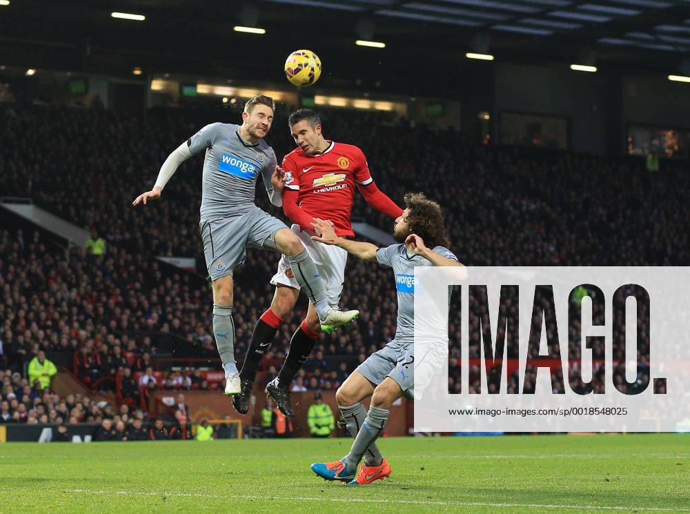 Manchester United ManU s Robin van Persie tussles with Newcastle s Paul Dummett Barclays Premier League - Manchester United vs Newcastle United - Old Trafford - England - 26th December 2014 - Picture David Klein Sportimage .