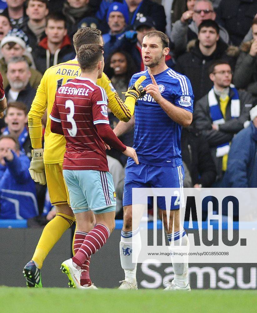 Football - 2014 2015 Premier League - Chelsea vs. West Ham United Chelsea s Branislav Ivanovic is challenged by West ham players, accusing him of diving at Stamford Bridge. COLORSPORT ANDREW COWIE