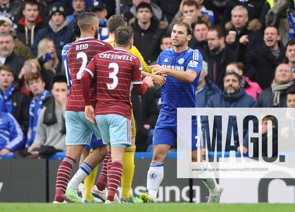 Football - 2014 2015 Premier League - Chelsea vs. West Ham United Chelsea s Branislav Ivanovic is challenged by West ham players, accusing him of diving at Stamford Bridge. COLORSPORT ANDREW COWIE