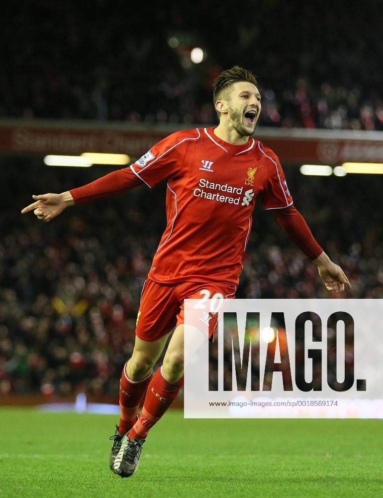 Adam Lallana of FC Liverpool celebrates after chasing down a back pass to score from the attempted clearance by Lucas Fabianski of Swansea City - Barclays Premier League - FC Liverpool vs Swansea City - Anfield Stadium - Liverpool - England - 29th December 2014 - .