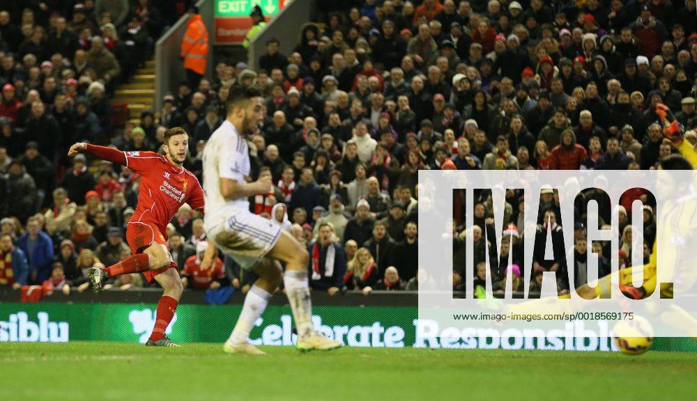 Adam Lallana of FC Liverpool scores the third goal past Lucas Fabianski of Swansea City - Barclays Premier League - FC Liverpool vs Swansea City - Anfield Stadium - Liverpool - England - 29th December 2014 - .