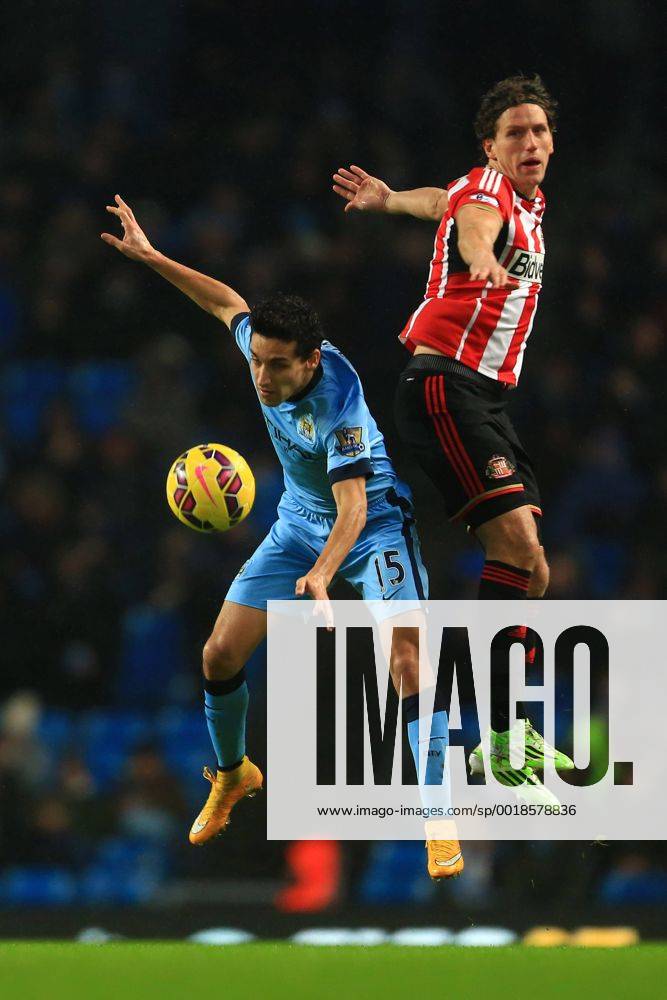 Jesus Navas of Manchester City and Billy Jones of Sunderland contest a header - Manchester City vs. Sunderland - Barclay s Premier League - Etihad Stadium - Manchester - 28 12 2014 Pic Philip Oldham Sportimage .