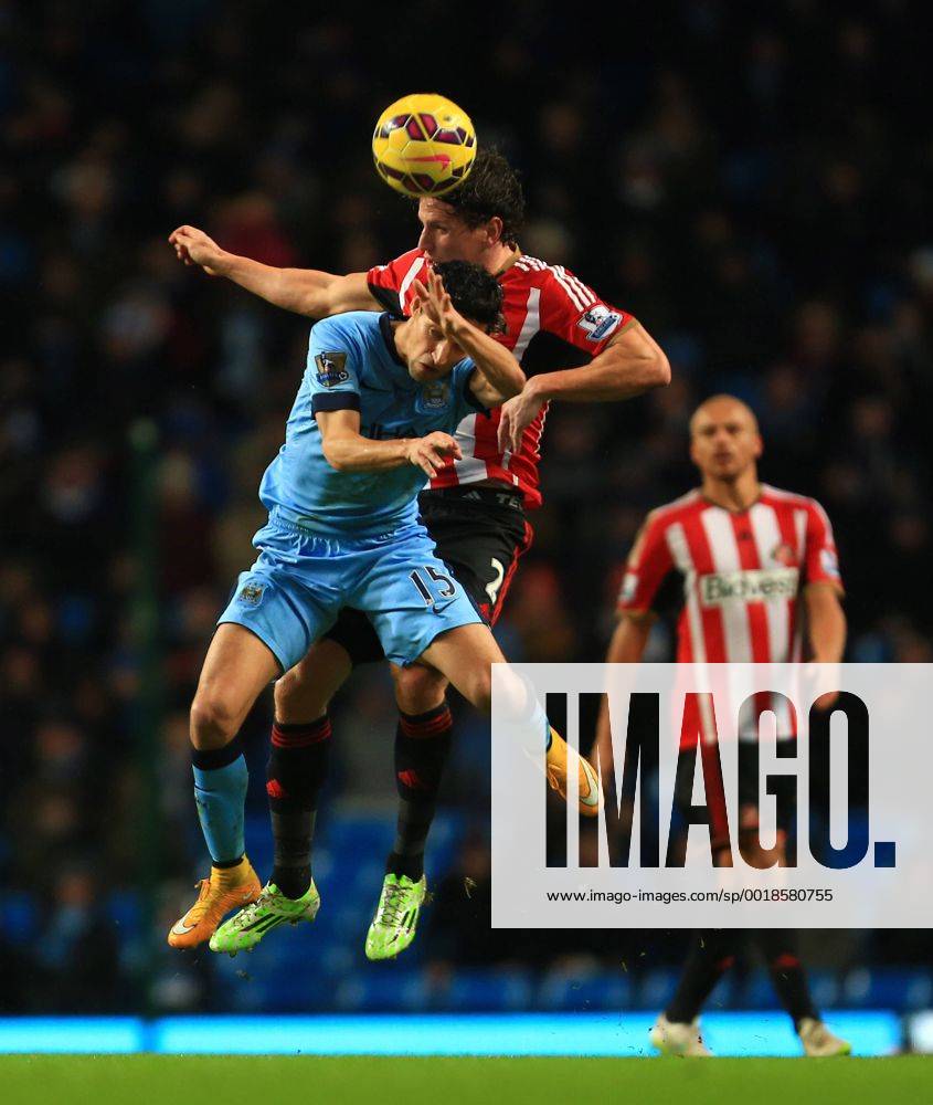 Jesus Navas of Manchester City and Billy Jones of Sunderland contest a header - Manchester City vs. Sunderland - Barclay s Premier League - Etihad Stadium - Manchester - 28 12 2014 Pic Philip Oldham Sportimage .