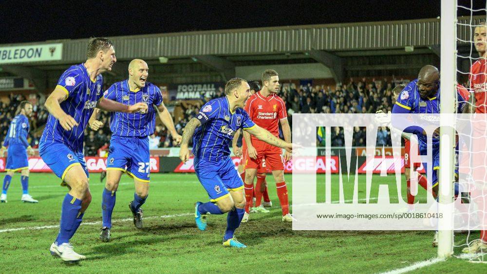 Aktuell Fußball, England, FA Cup, AFC Wimbledon - FC Liverpool Football - 2014 2015 FA Cup - Third Round: AFC Wimbledon - FC Liverpool, AFC Wimbledon s Adebayo Akinfenwa turns away in celebration after scoring the equalising goal at The Cherry Red Records Stadium WIM_LIV