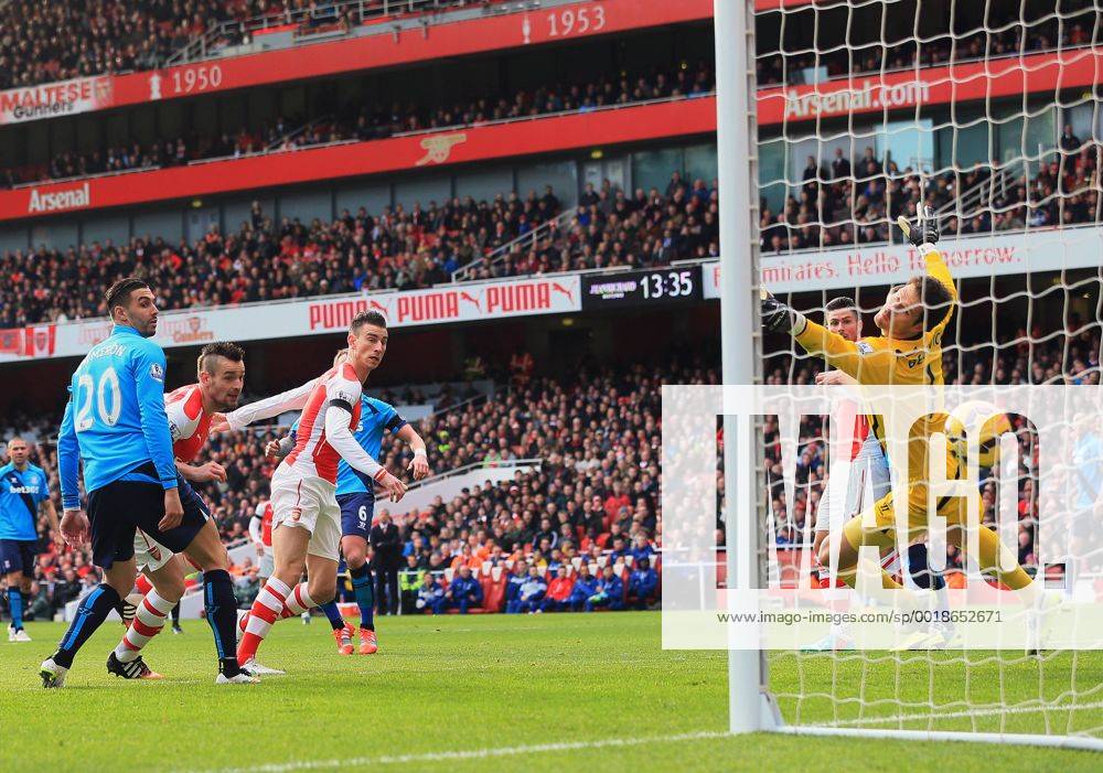 Arsenal s Laurent Koscielny scoring his sides opening goal Premier League - Arsenal vs Stoke City - Emirates Stadium - England - 11th January 2015 - Picture David Klein Sportimage .