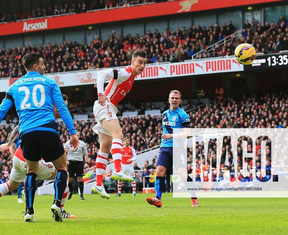 Arsenal s Laurent Koscielny scoring his sides opening goal Premier League - Arsenal vs Stoke City - Emirates Stadium - England - 11th January 2015 - Picture David Klein Sportimage .