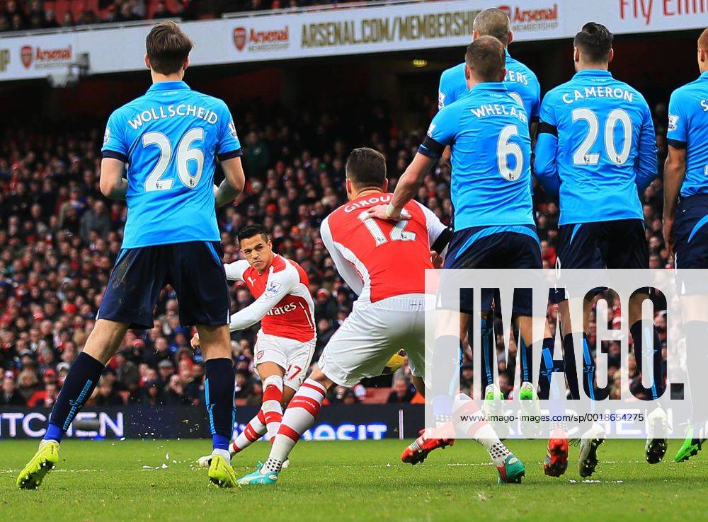 Arsenal s Alexis Sanchez scoring his sides third goal Premier League - Arsenal vs Stoke City - Emirates Stadium - England - 11th January 2015 - Picture David Klein Sportimage .
