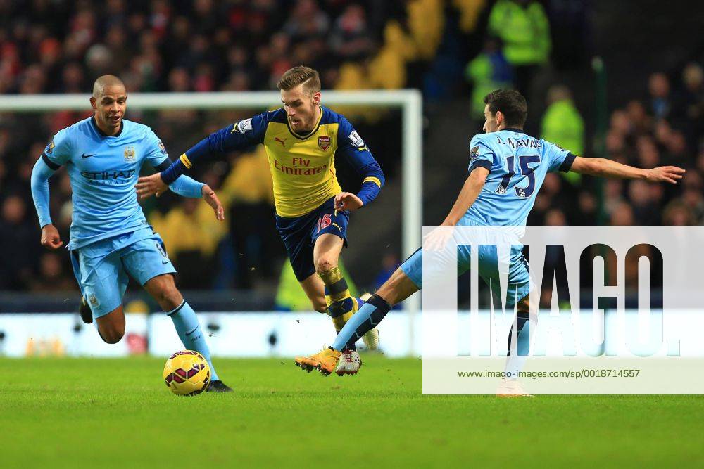 Arsenal s Aaron Ramsey skips past Jesus Navas of Manchester City - Manchester City vs. Arsenal - Barclay s Premier League - Etihad Stadium - Manchester - 18 01 2015 Pic Philip Oldham Sportimage .