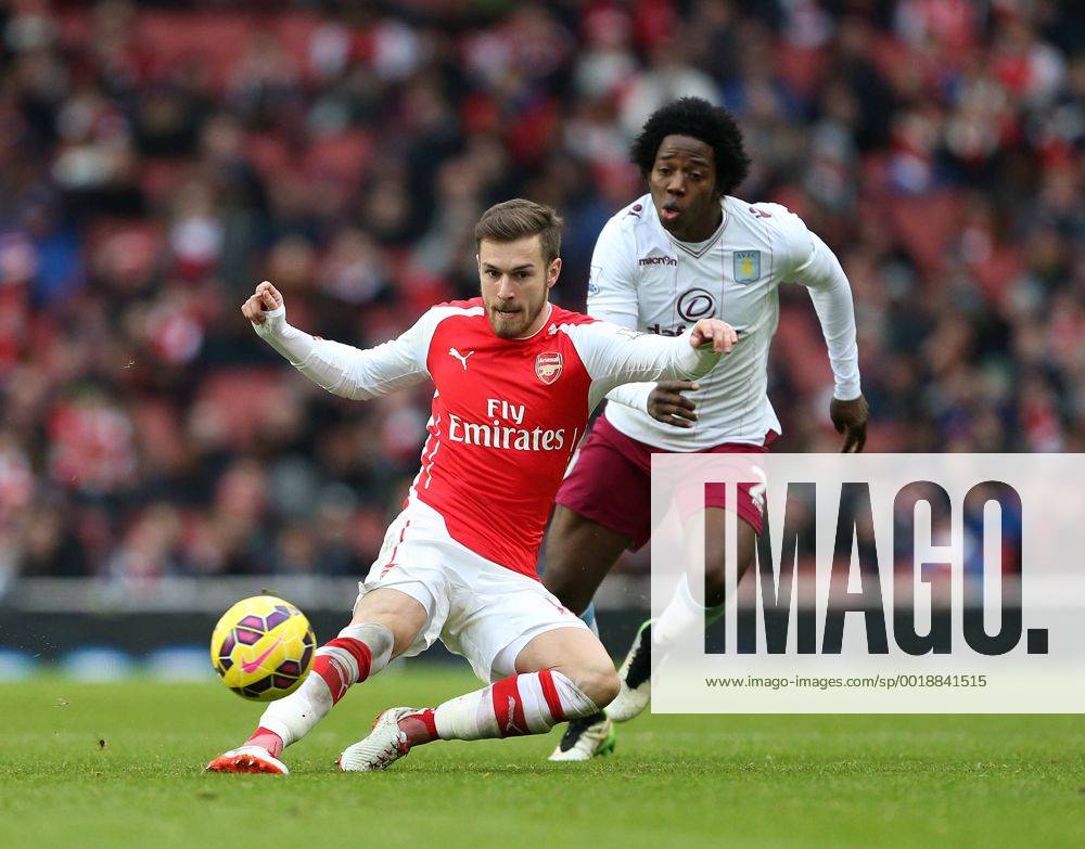 Arsenal s Aaron Ramsey tussles with Aston Villa s Carlos Sanchez Barclays Premier League - Arsenal vs Aston Villa - Emirates Stadium - England - 1st February 2015 - Picture David Klein Sportimage .