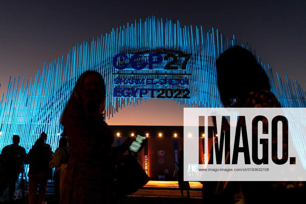 COP27 In Sharm El Sheikh - Day 4 Participants stand in front of the main entrance of COP27 venue on the fourth day of the COP27 UN Climate Change Conference, held by UNFCCC in Sharm El-Sheikh International Convention Center, Egypt on November 10, 2022. COP27, running from November 6 to November 18 in Sharm El Sheikh focuses on implementation of measures already agreed during previous COPs. The Conference in Sharm El Sheikh focuses also on the most vulnerable communities as the climate crisis hardens life conditions of those already most disadvantaged. Sharm El Sheikh South Sinai Egypt