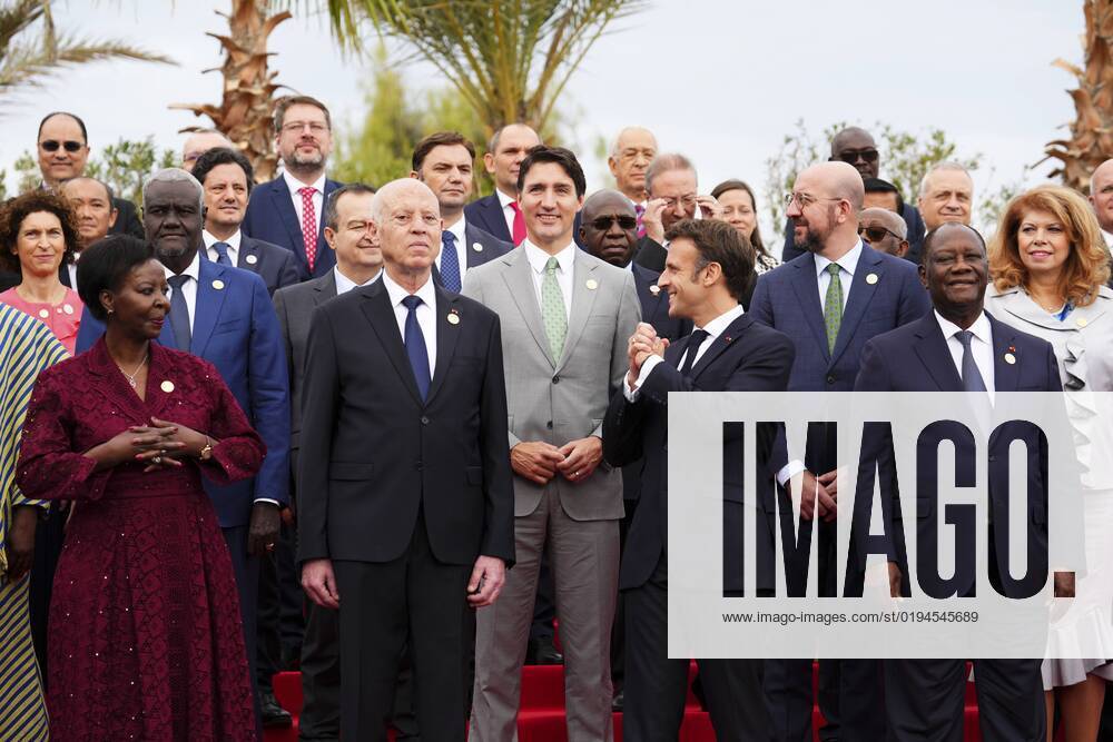 French President Emmanuel Macron, front second from right, gestures to Prime Minister Justin Trudeau and fellow leaders during the family photo at the Francophonie Summit in Djerba, Tunisia on Saturday, Nov. 19, 2022. Djerba Tunisia - ZUMAc35_ 20221119_zaf_c35_011