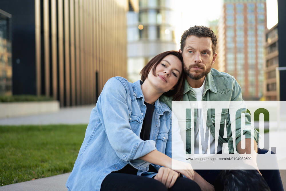 Couple wearing denim shirts sitting on bench model released, Symbolfoto, MOEF04321