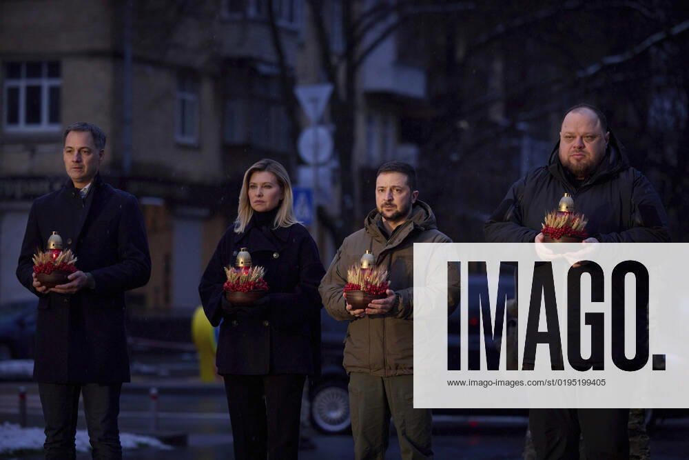 Ukrainian President Volodymyr Zelenskyy, and First Lady Olena Zelenska stand for a moment of silence alongside Belgian Prime Minister Alexander De Croo, left, and Ukranian Parliament Speaker Ruslan Stefanchuk, right, in honor of the 90th anniversary of the Holodomor famine, November 26, 2022 in Kyiv, Ukraine. Kyiv Ukraine - ZUMAp138 20221126_zaa_p138_077