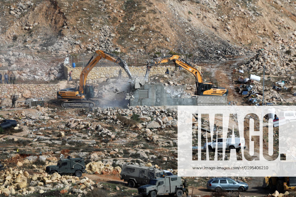 Excavators of the Israeli army demolish two Palestinian houses in the Jabal Johar area of Hebron city, near the Kiryat Arba Israeli settlement, in the West Bank Excavators of the Israeli army demolish two Palestinian houses in the Jabal Johar area of Hebron city, near the Kiryat Arba Israeli settlement, in the West Bank, on November 28, 2022. Photo by Mamoun Wazwaz APAimage Hebron West Bank Palestinian Territory 281122_HEBRON_MW_00 (10)