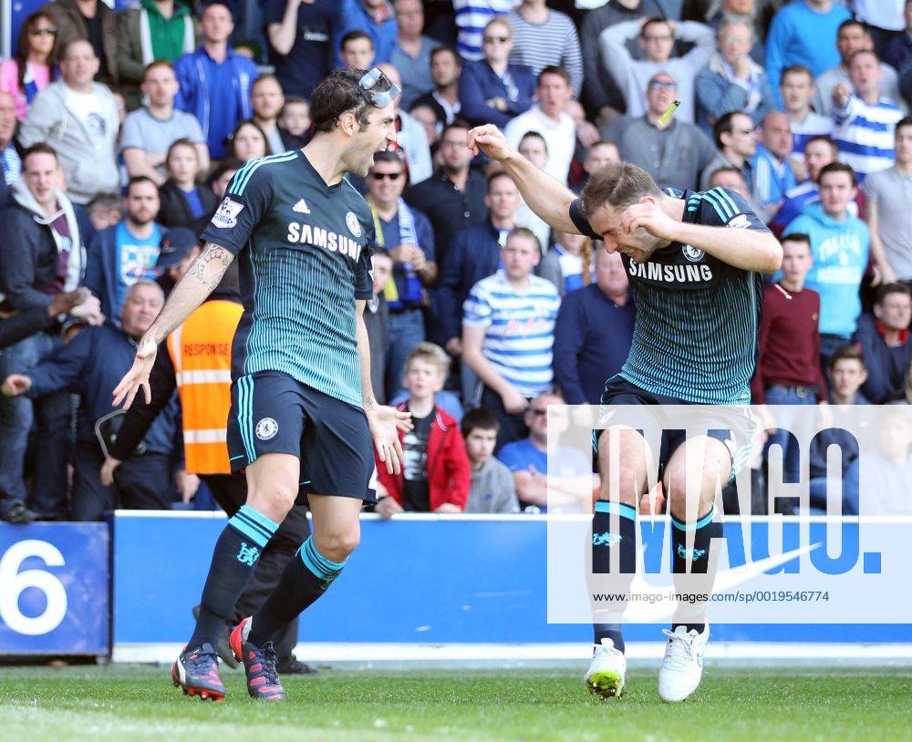 Chelsea s Cesc Fabregas celebrates scoring his sides opening goal as Branislav Ivanovic gets hit by a coin Barclays Premier League- Queens Park Rangers vs Chelsea - Loftus Road - England - 12h April 2015 - Picture David Klein Sportimage .