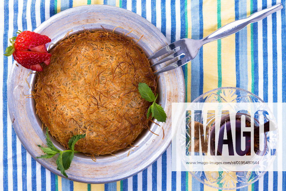 IMAGO Creative, Food, Künefe Turkish dessert kunefe isolated on a picnic cloth with mints and sliced strawberry along with Turkish hot tea , 9359466.jpg, Dough, Food, Freshness, Ingredient, Macro, Plate, appetizer, arabic, bakery, baking, butter, cheese, cloth, cooking, cuisine, delicious, dessert, dinner, east, ethnic, fillo, fork, golden, gourmet, greek, hatay, hot, isolated, kadaifi, kadayif, kanafeh, kataifi, kunafeh, kunefe, leaves, lebanese, lunch, meal, mediterranean, mersin, middle eastern, mint, pastry, restaurant, shredded, strawberry, sweet, syrup, table, tea, traditional, turkish,