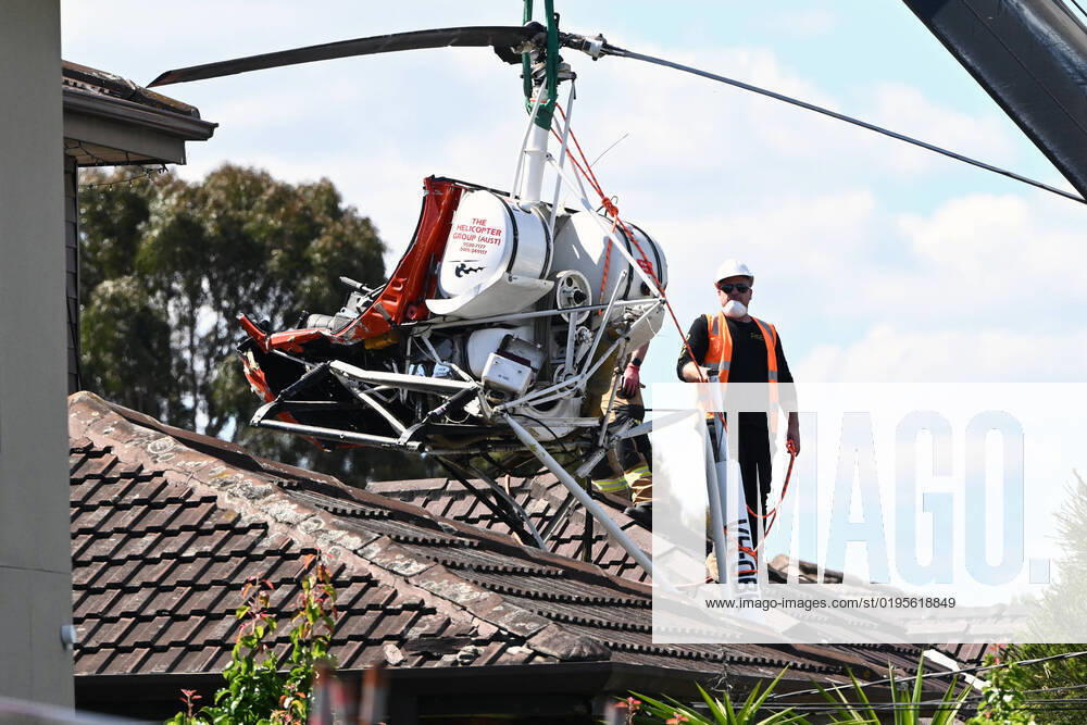 HELICOPTER CRASH MELBOURNE, Emergency services remove the wreckage of a helicopter from the repp of a home in Mentone, a suburb of Melbourne, Wednesday, November 30, 2022. A helicopter pilot has been taken to hospital after his aircraft crashed through the roof of a home in Melbourne s southeast. ( NO ARCHIVING, , NO USE IN BOOKS WITHOUT CONSENT MELBOURNE VICTORIA AUSTRALIA