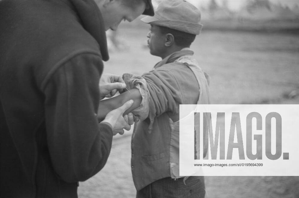 Vaccination in the camp for Negro flood refugees at Marianna, Arkansas, 1937. Creator: Walker Evans.