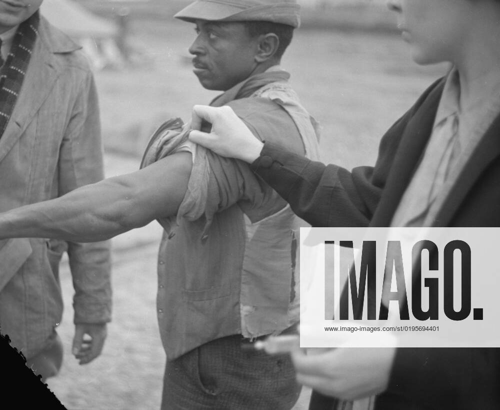 Vaccination in the camp for Negro flood refugees at Marianna, Arkansas, 1937. Creator: Walker Evans.