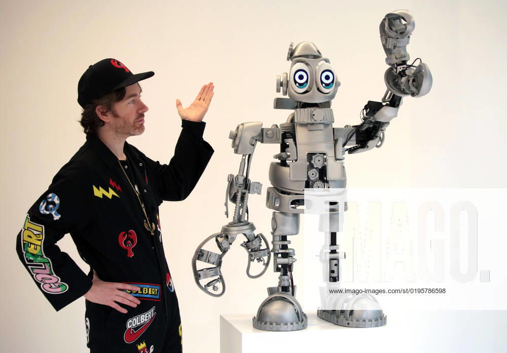 Philip Colbert London, UK. Philip Colbert with his art-making LobsterBot at the auction house Phillips, Berkeley Square. The Scottish born artist is convinced robotics will play a significant role in the future of art. He teamed up with the University College London s Robotics Lab to come up with this performative sculpture. The data driven robot will create artwork for people who will be able to control it via a smartphone and other digital devices. The results will come from the LobsterBot s artificial intelligence as it learns how to create new works. These will then come part of an exhibition to be held in 2023. 1st December 2022. LMK11-011222-001