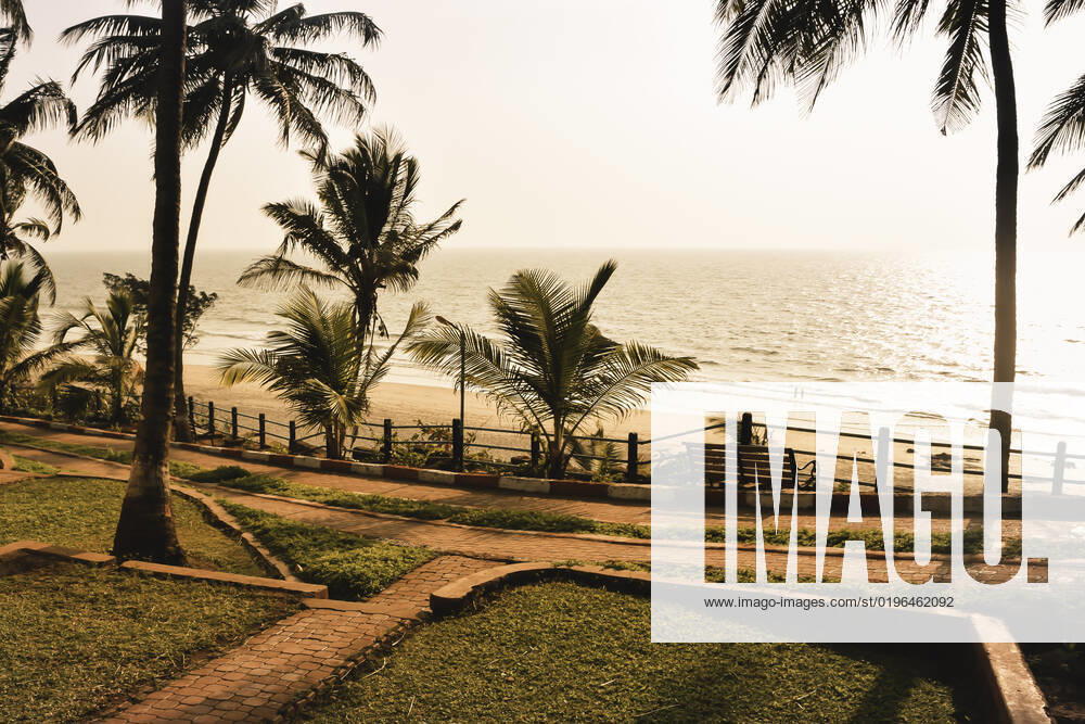 Panorama landscape view of a beautiful tropical sea beach in sunset time during christmas holiday. ( MUMBAI, MAHARASTRA, INDIA). Travel vacation and holiday concept. , 27404336.jpg, silhouette, vacation, sunrise, resort, summer, sun, sky, paradise, palm-tree, travel, coconut, orange, nature, exotic, dusk, trees, yellow, island, ocean, evening, background, light, twilight, sunlight, scenery, tranquil, scene, water, leaf, sundown, golden, caribbean, maldives, tropic, coastal-sand, thailand, holiday, colorful, shore-coast, asia, lagoon, miami, hawaii, islands, bali, morning, lucia, bahamas, jamaica, wave,
