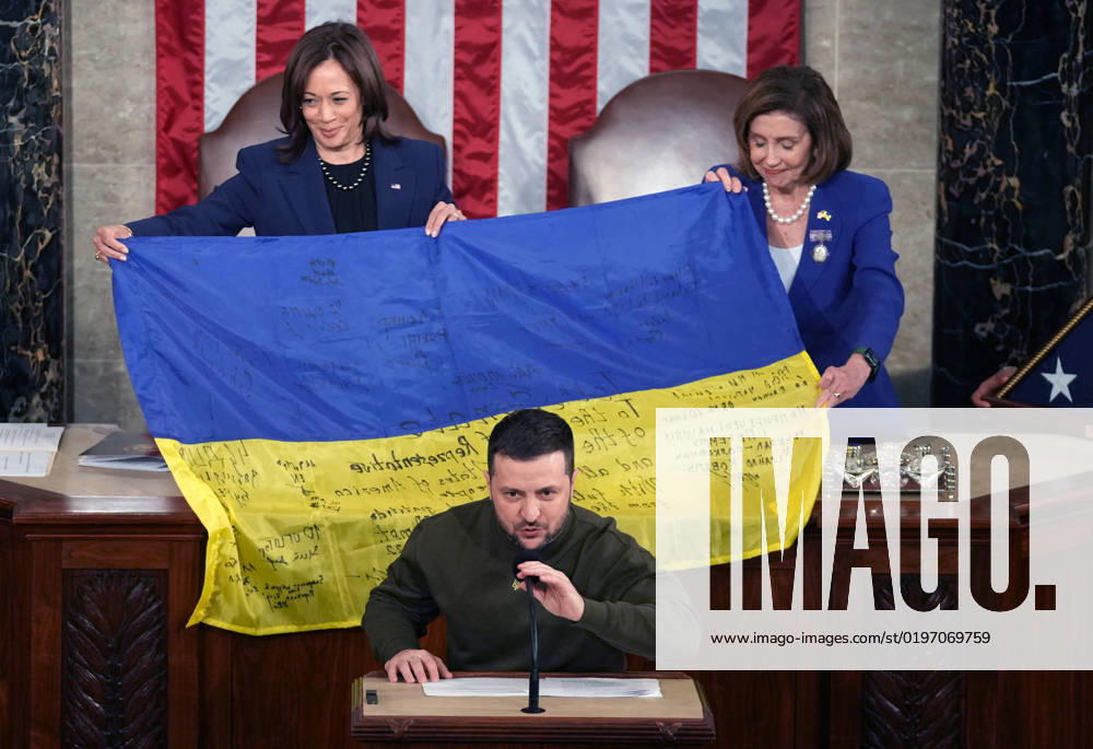 Vice President Kamala Harris (L) and Speaker of the House Nancy Pelosi (R) hold a Ukrainian flag presented to them by President Volodymyr Zelensky of Ukraine after he addressed a joint session of Congress at the U.S. Capitol in Washington, DC on Wednesday, December 21, 2022. Zelensky met with President Joe Biden earlier in the day as the White House announced an additional $2 billion in military assistance for Ukraine, including a sophisticated Patriot missile battery. WAS20221221744 PATxBENIC