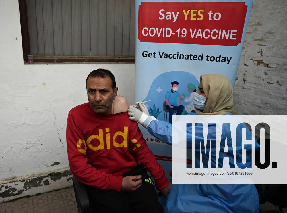 A man receives a shot of booster dose of COVID19 vaccine on December 27, 2022 in Srinagar, India. Reports of a massive surge in Covid-19 infections in China and apprehensions over the possibility of a spill-over effect in India has led to a sharp uptick in the vaccination intake in the country. In the past week on Friday (December 23) and Saturday, more than one lakh vaccinations were administered in India against an average of between 40,000 and 50,000 doses through most of this month.(Photo By Waseem Andrabi Hindustan Times) Amid China Scare, Covid Booster Vaccination Picks Up In India