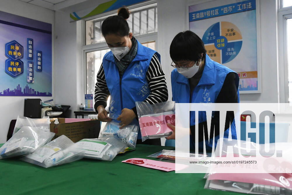 (221227) -- BEIJING, Dec. 27, 2022 -- Community workers prepare care packages in a residential community in Yangfangdian Subdistrict of Haidian District in Beijing, capital of China, Dec. 27, 2022. In Yangfangdian Subdistrict, care packages including medicines and COVID-19 prevention materials have been offered for senior residents living alone and those with disabilities. Shared medical kits have also been provided for residents in case of emergency. ) CHINA-BEIJING-COVID-19 PREVENTION-CARE PACKAGES (CN) RenxChao