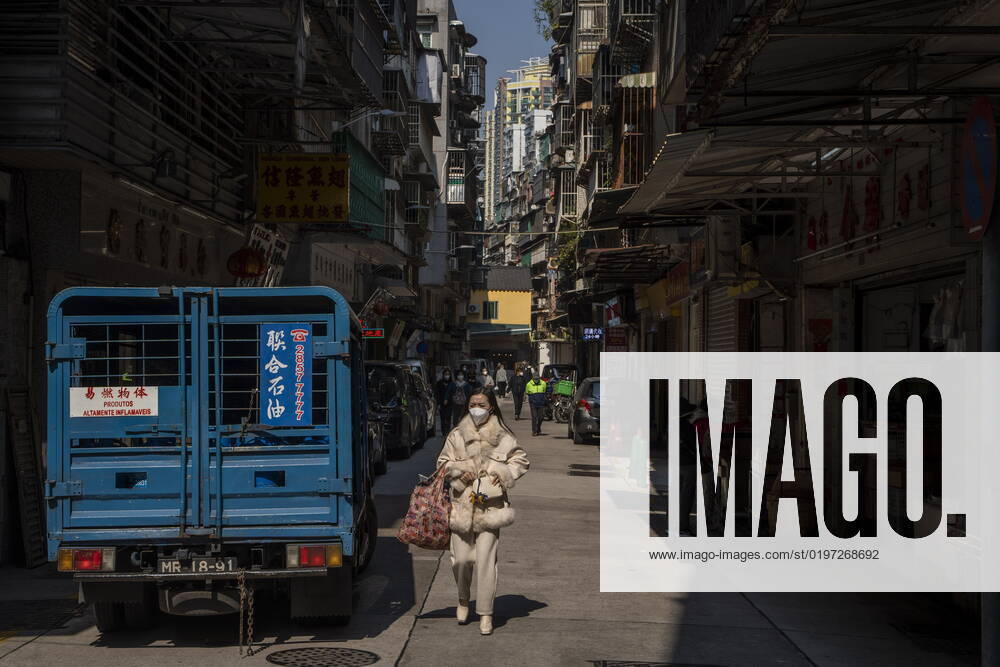 Daily Life In Macau A women wearing a face mask walks downs a street on December 29, 2022 in Macau, China. Macau Macau