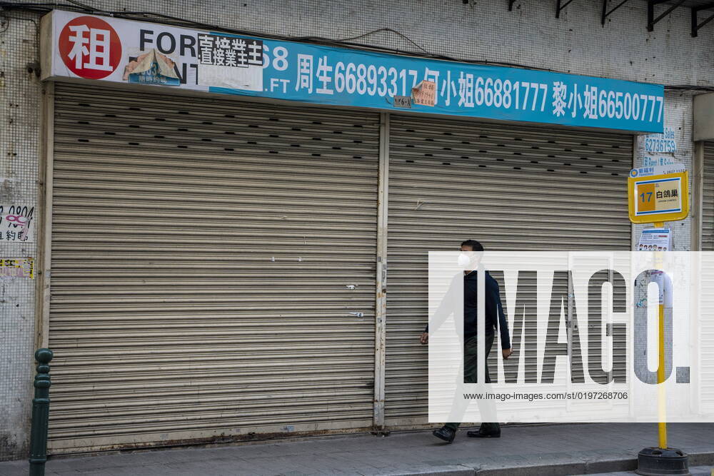 Daily Life In Macau A man wearing a face mask walks pass a closed store on December 29, 2022 in Macau, China. Macau Macau