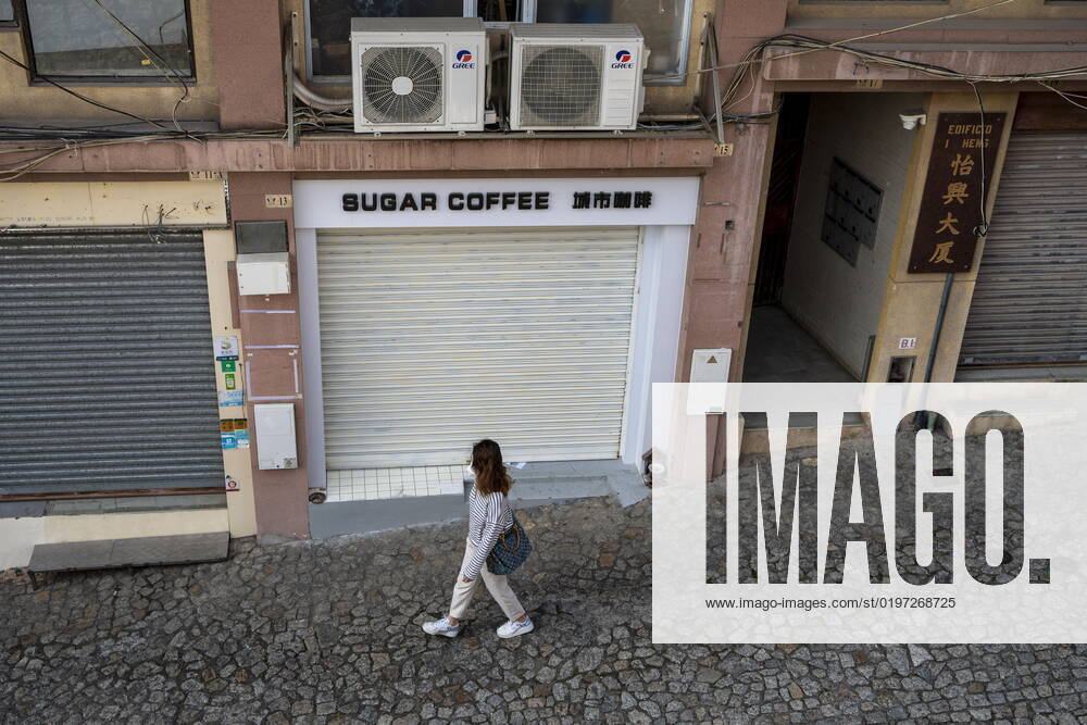 Daily Life In Macau A women walks pass closed stores near the Ruins of St. Paul s on December 29, 2022 in Macau, China. Macau Macau
