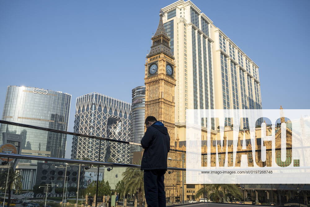 Daily Life In Macau A man standing front of hotels , resorts and Casinos on the Cotai Strop on December 29, 2022 in Macau, China. Macau Macau