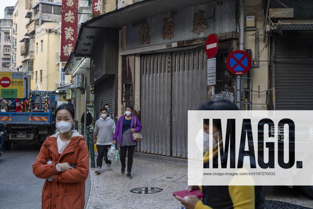 Daily Life In Macau People wearing face masks walk pass closed stores on December 29, 2022 in Macau, China. Macau Macau