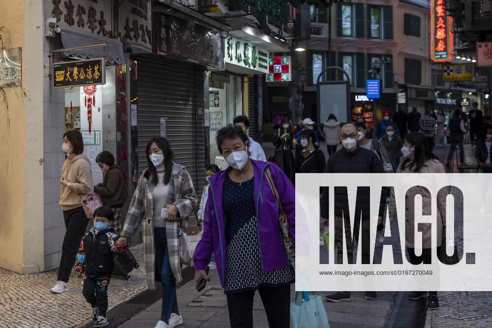 Daily Life In Macau People wearing face masks walk down a street on December 29, 2022 in Macau, China. Macau Macau