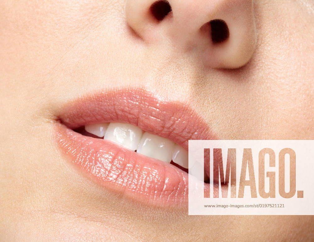 Closeup macro portrait of female part of face. Human woman lips with day beauty makeup Human mouth and nose. Closeup macro portrait of female part of face. Woman lips with day beauty makeup.