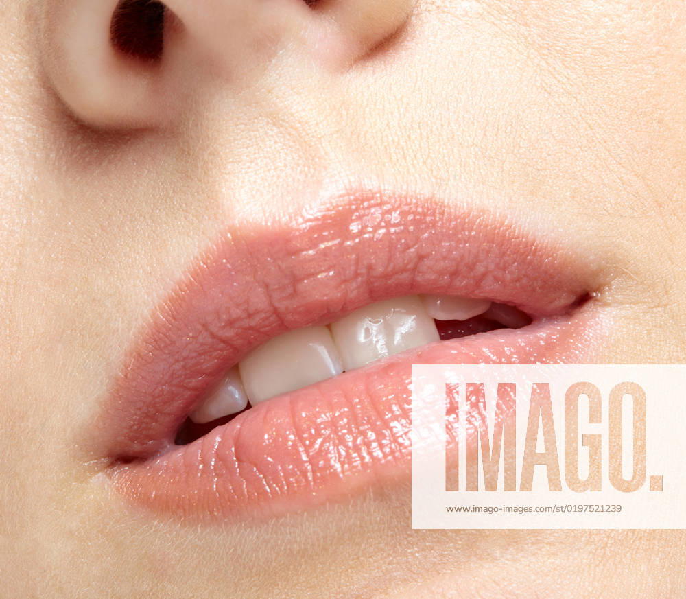 Closeup macro portrait of female part of face. Human woman lips with day beauty makeup Human mouth and nose. Closeup macro portrait of female part of face. Woman lips with day beauty makeup.