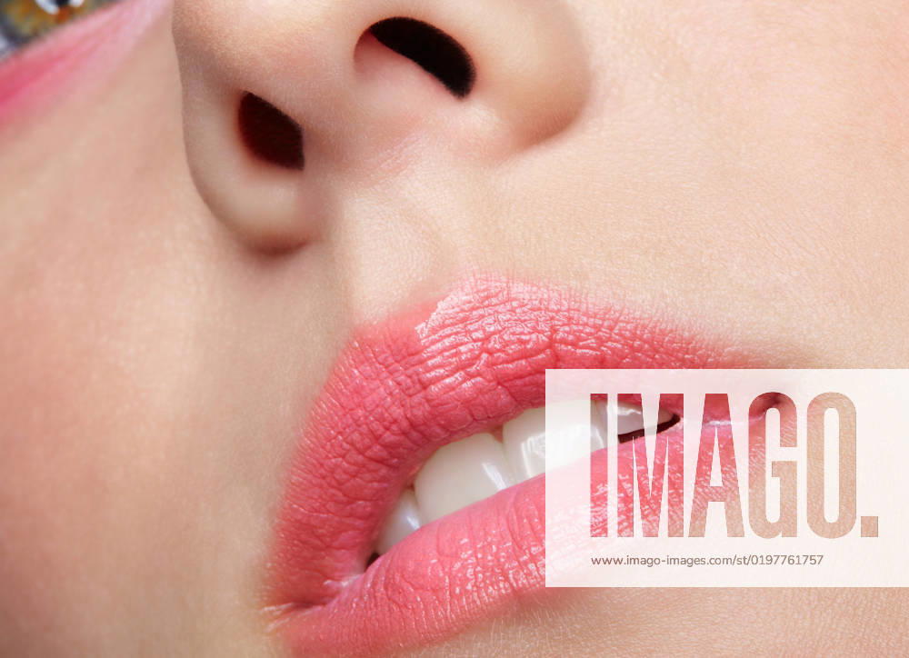 Closeup macro portrait of female part of face. Human woman lips with day beauty makeup Human mouth and nose. Closeup macro portrait of female part of face. Woman lips with day beauty makeup.