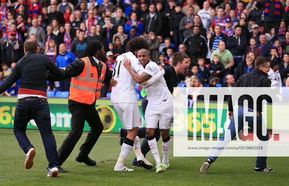 Manchester United ManU s Marouane Fellaini celebrates scoring his sides second goal as fans invade the pitch Barclays Premier League - Crystal Palace vs Manchester United- Selhurst Park - England - 9th May 2015 - Picture David Klein Sportimage .