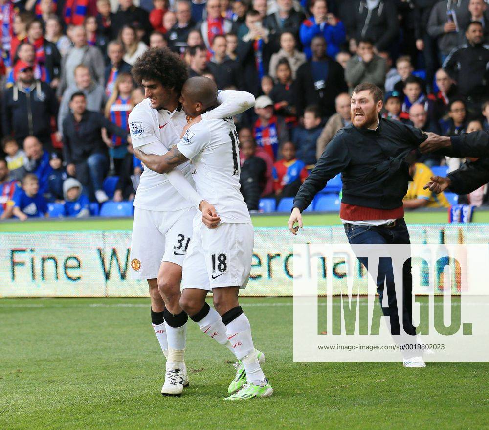 Manchester United ManU s Marouane Fellaini celebrates scoring his sides second goal as fans invade the pitch Barclays Premier League - Crystal Palace vs Manchester United- Selhurst Park - England - 9th May 2015 - Picture David Klein Sportimage .