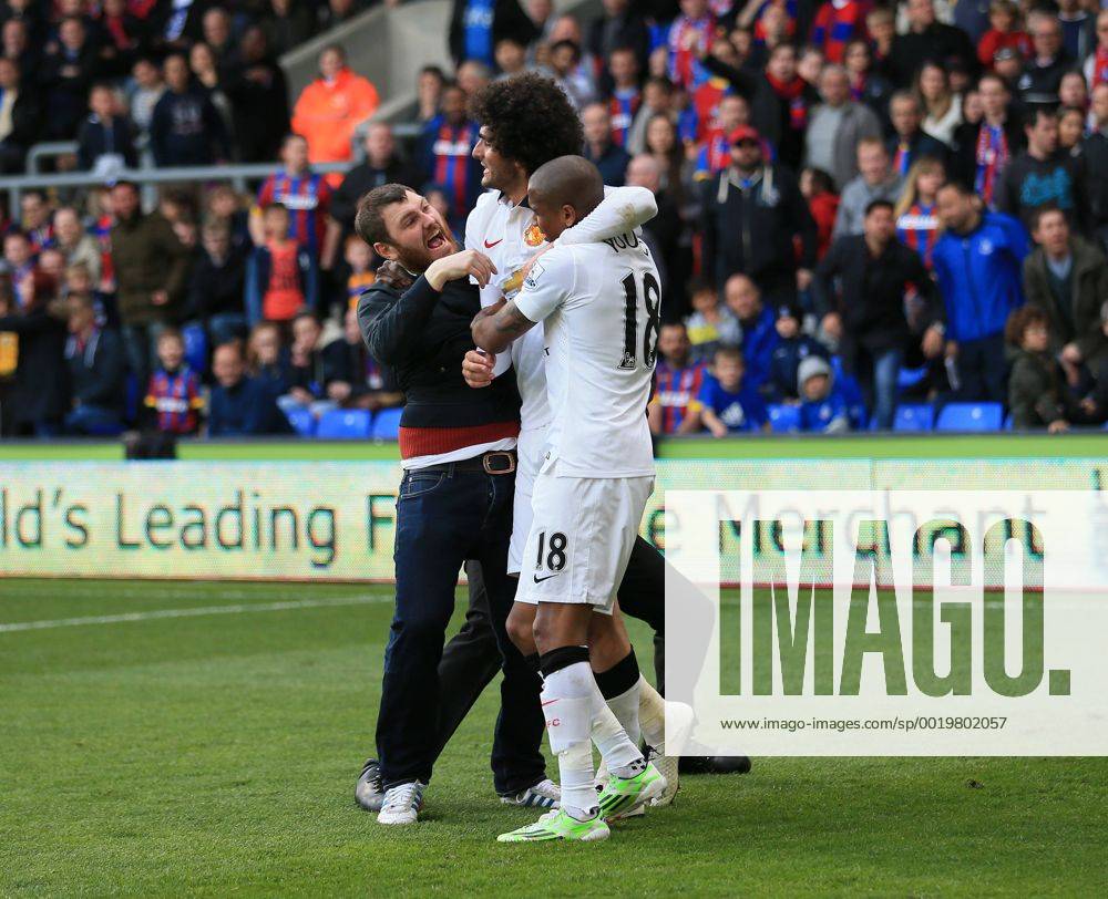 Manchester United ManU s Marouane Fellaini celebrates scoring his sides second goal as fans invade the pitch Barclays Premier League - Crystal Palace vs Manchester United- Selhurst Park - England - 9th May 2015 - Picture David Klein Sportimage .
