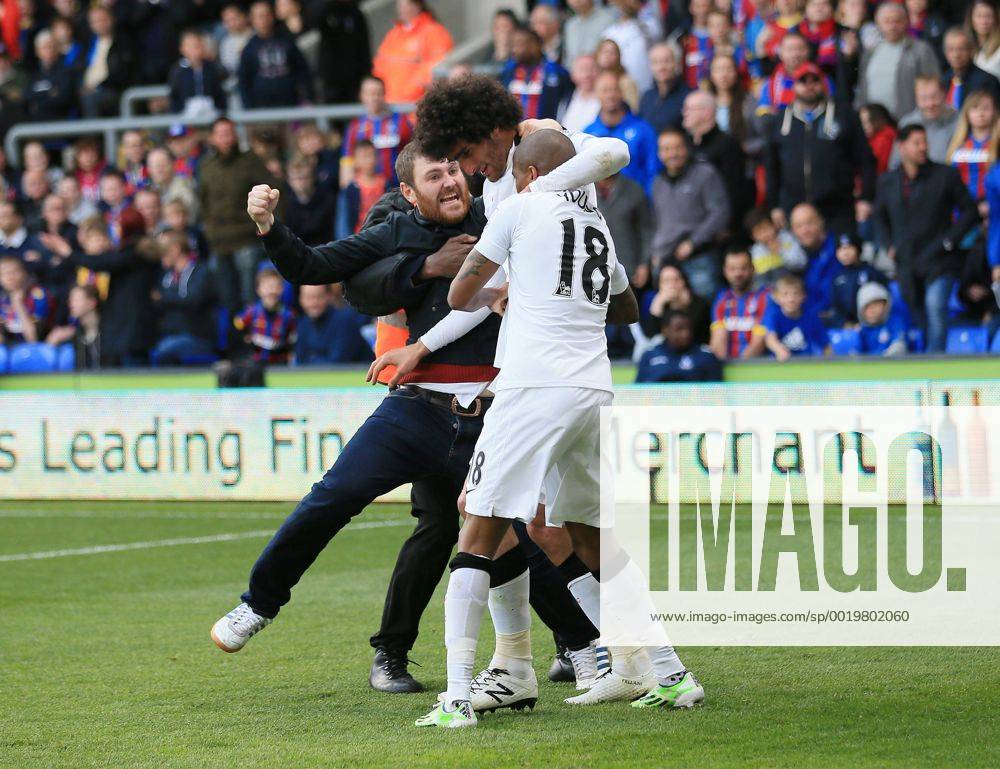 Manchester United ManU s Marouane Fellaini celebrates scoring his sides second goal as fans invade the pitch Barclays Premier League - Crystal Palace vs Manchester United- Selhurst Park - England - 9th May 2015 - Picture David Klein Sportimage .