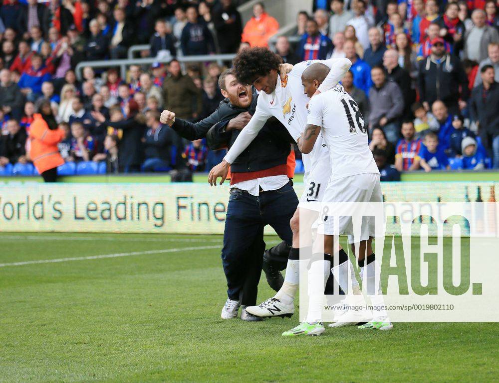 Manchester United ManU s Marouane Fellaini celebrates scoring his sides second goal as fans invade the pitch Barclays Premier League - Crystal Palace vs Manchester United- Selhurst Park - England - 9th May 2015 - Picture David Klein Sportimage .