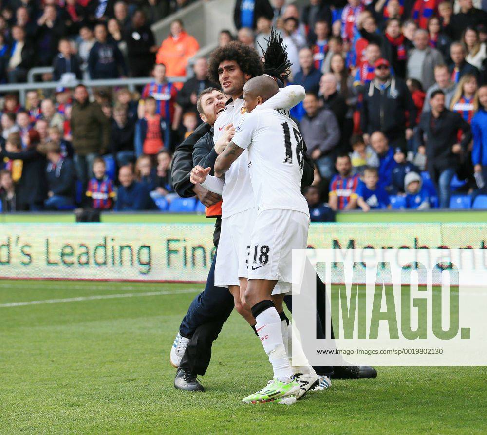Manchester United ManU s Marouane Fellaini celebrates scoring his sides second goal as fans invade the pitch Barclays Premier League - Crystal Palace vs Manchester United- Selhurst Park - England - 9th May 2015 - Picture David Klein Sportimage .